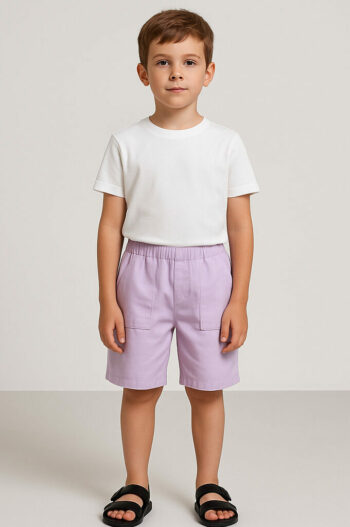 a boy wearing a white shirt and purple shorts