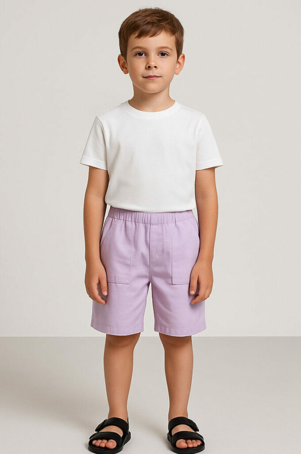 a boy wearing a white shirt and purple shorts